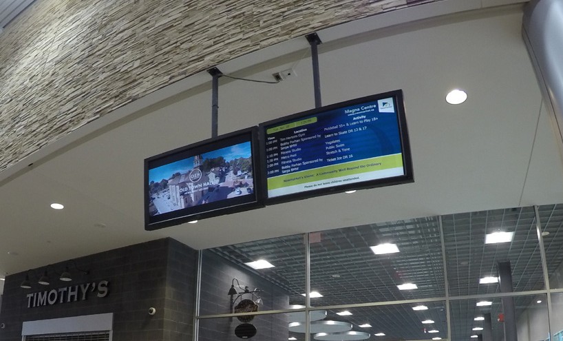 Image of LCD screens showing advertisements at the magna centre